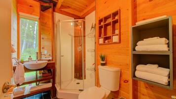 Shower, hair dryer, towels, toilet paper