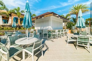 Outdoor dining - Cheerful 8 Bedroom Vacation Home with Pool/Games (Four Corners)