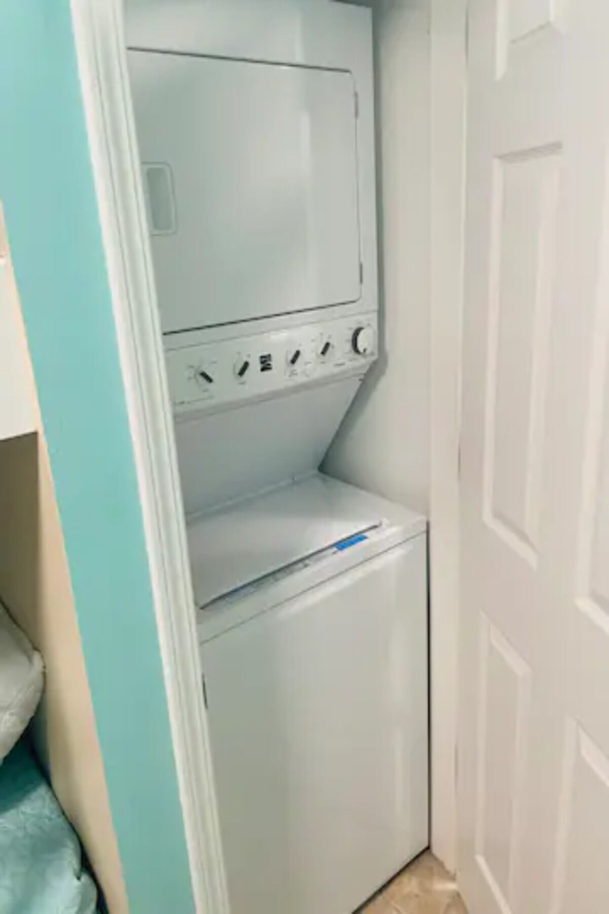 A compact laundry room with a washing machine and dryer.