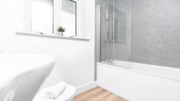 Shower, hair dryer, towels, soap