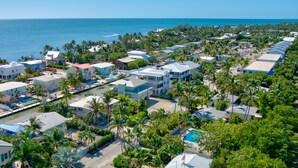 A coastal residential area with houses, a marina, and a clear view of the ocean. -  Bungalow #3 - 2 Bed/1 Bath & Pool in Islamorada (Islamorada)