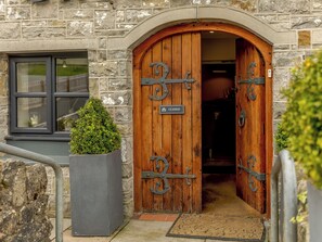 A stone building with a wooden door marked "CLOSED".