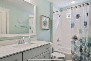 Bathtub, hair dryer, towels, soap