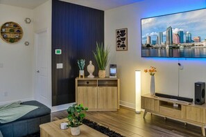 Smart TV, fireplace, video-game console, foosball
