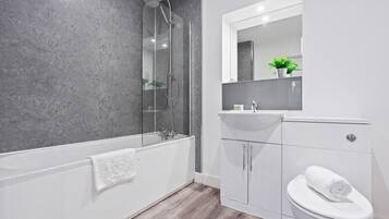 Shower, hair dryer, towels, soap