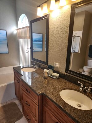 Bathtub, hair dryer, towels