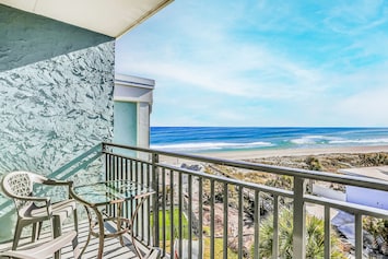 Image of Polished oceanfront condo with pool access, private balcony & washer/dryer