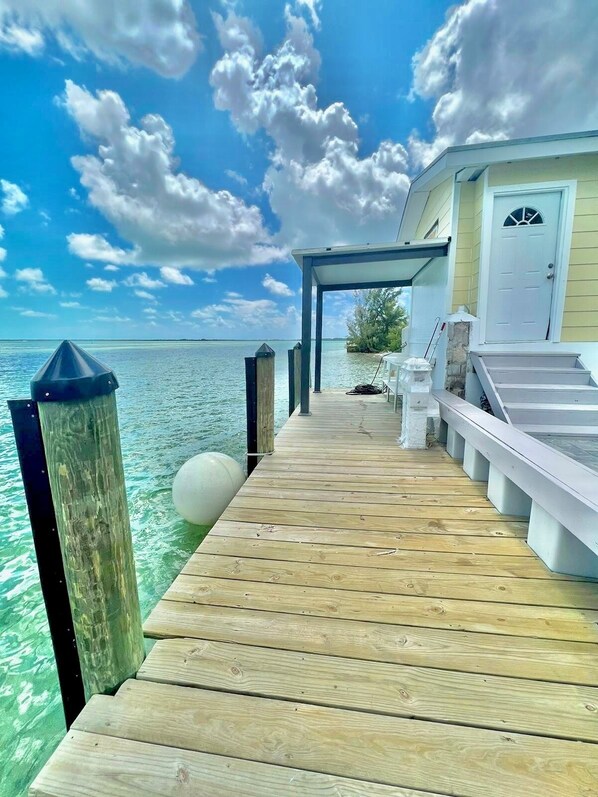Guests can walk along the pier to access the building's entrance.