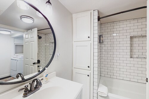Lower-level dog-friendly home with a porch, AC, parking & washer/dryer