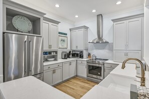 Modern kitchen completely stocked with all the appliances you need.