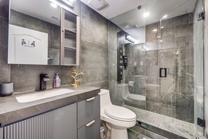 Shower, hair dryer, towels, soap
