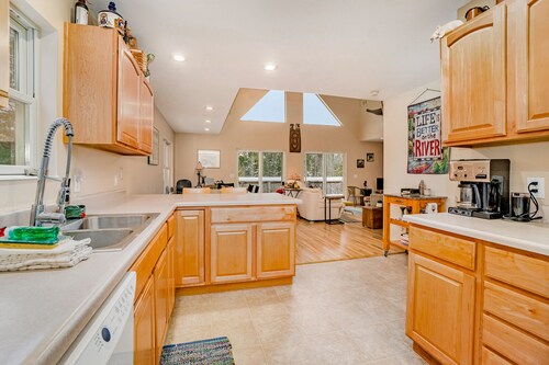 Dog-friendly riverside retreat with canoe, kayaks, paddle-board, and wood stove