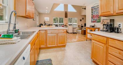 Dog-friendly riverside retreat with canoe, kayaks, paddle-board, and wood stove