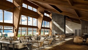 A spacious lobby with high ceilings, large windows, and a variety of seating arrangements. - Ngorongoro Lodge member of Meliá Collection - The Leading Hotels of the World (Ngorongoro)