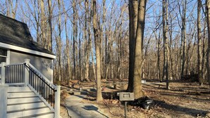 A house with a stone pathway leading to a mailbox. - A-Frame Mountain Retreat (Gerrardstown)