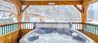 Dog-friendly, mountain-view cabin with shared hot tub, fireplace, & central AC