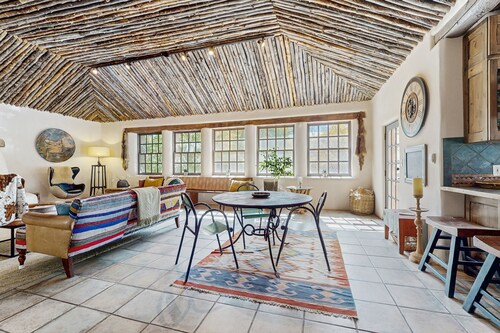 Historic dog-friendly hacienda with 2 casitas, fireplaces, on-site hot tub, yoga