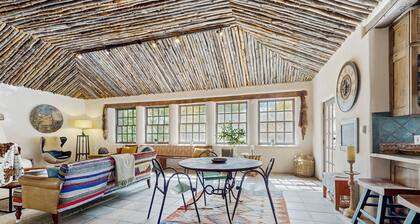 Historic dog-friendly hacienda with 2 casitas, fireplaces, on-site hot tub, yoga