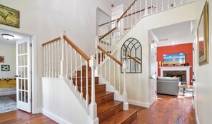 A staircase with white railings and wooden steps leading to an upper floor. - Rustic Hideaway - Modern Estate - Great Location + Pet Friendly! (Windermere)