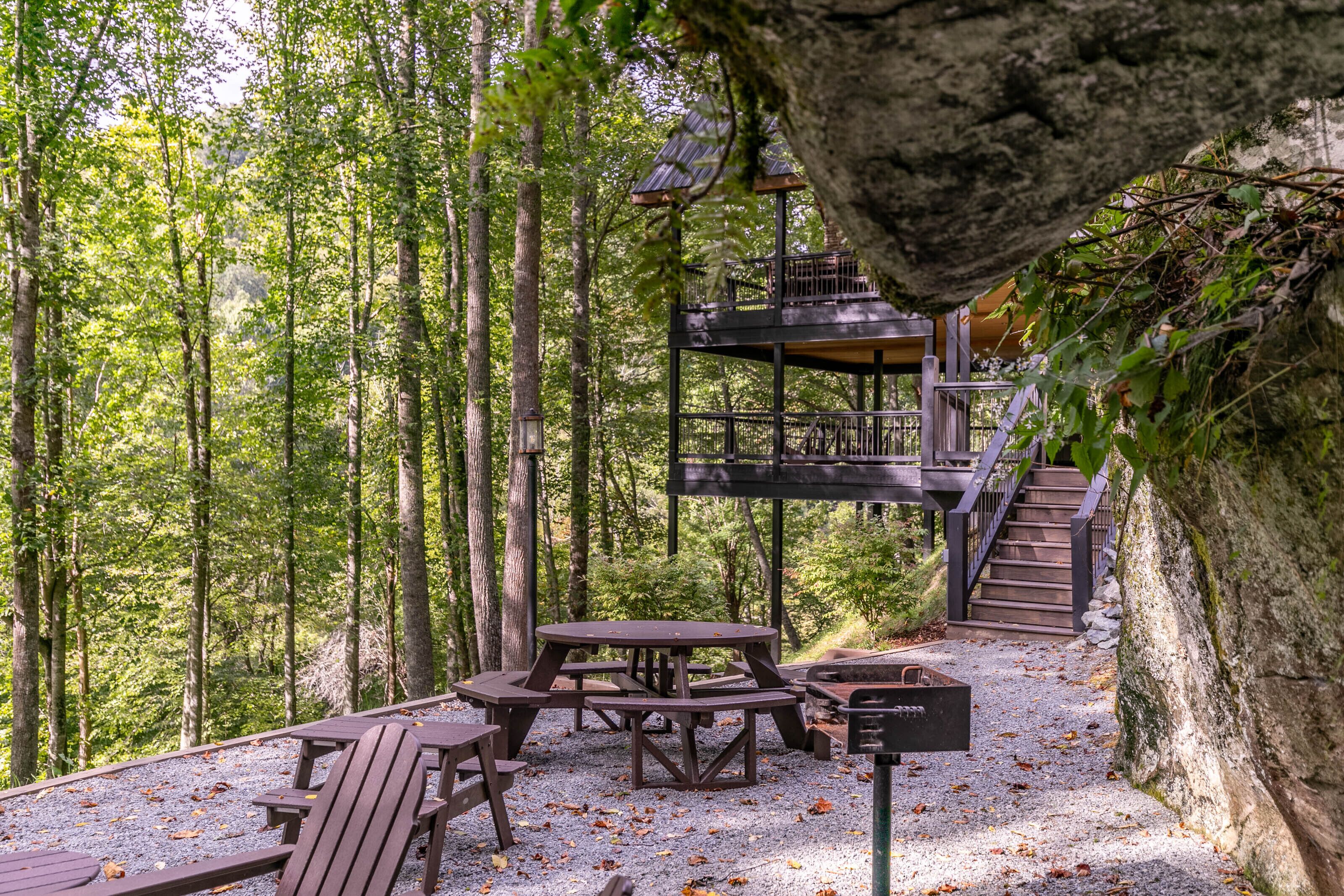 Gather around the fire pit under the trees, then head up to the multi-level deck for even more fresh mountain air.