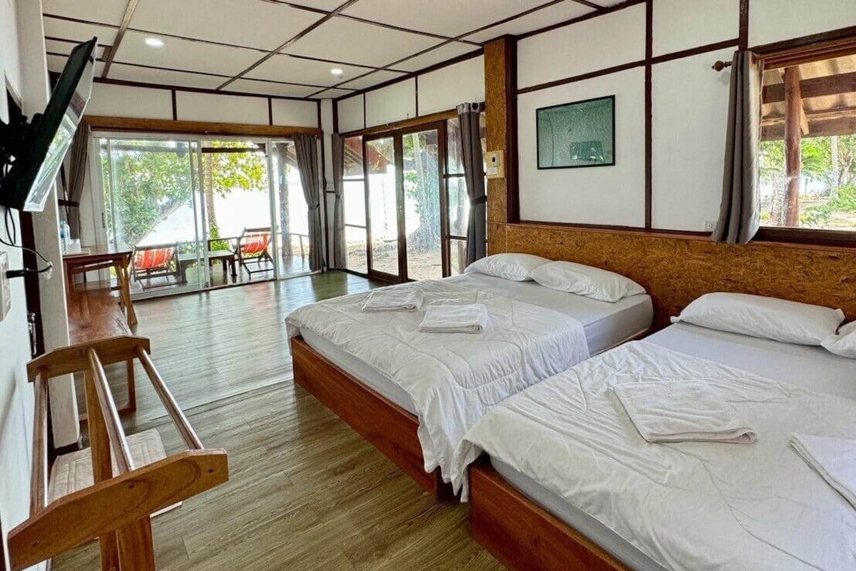 Family Quadruple Room, 2 Queen Beds, Air conditioning, Sea View | Desk, laptop workspace, blackout drapes, soundproofing