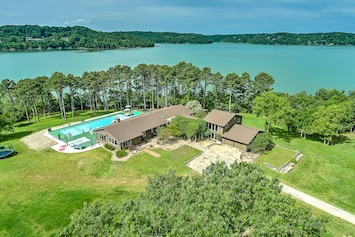 Image of Dog-friendly home with lake views, washer/dryer, pool, basketball & fireplace