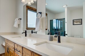 Bathtub, hair dryer, towels, soap