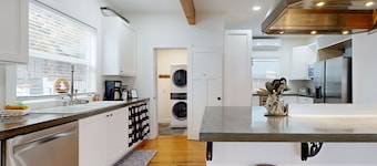 Relaxing river-view home with private patio, grill, covered balcony, & W/D