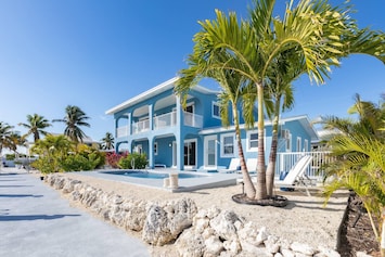 Experience the beauty of a well-appointed outdoor living space, offering the perfect setting to relish the fantastic weather of the Florida Keys at Bl