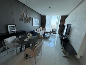 Family Apartment | Living area | 50-inch Smart TV with digital channels - DAMAC Riyadh - Luxury Apartments داماك الرياض (Riyadh)