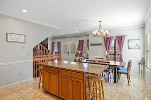 Enjoy meals in the kitchen with a large island and dining area.