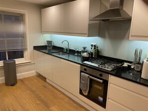 Apartment, 1 Queen Bed | Private kitchen | Fridge, microwave, oven, stovetop