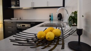 A kitchen with a white countertop, a sink, and a plant. - Ref: 240  Modern beautiful apartment with amazing sea views (Fuengirola)