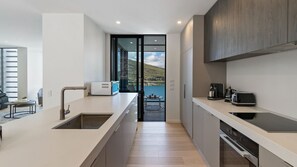 Fridge, microwave, oven, stovetop - Wai Maunga Villa | Hot Tub | Lake and Mountain Views (Queenstown)