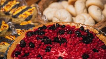 A variety of pies and pastries on a table.