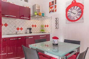 Fridge, stovetop, coffee/tea maker, cookware/dishes/utensils