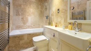 A bathroom with a bathtub, toilet, and sink. - Apartment 4 - The Kings -  a family break that sleeps 4 guests  in 2 bedrooms (York)
