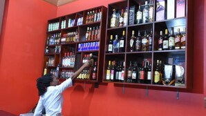 A bar area with shelves stocked with various liquor bottles. - Day 2 Day Prime Hotel (Kampala)