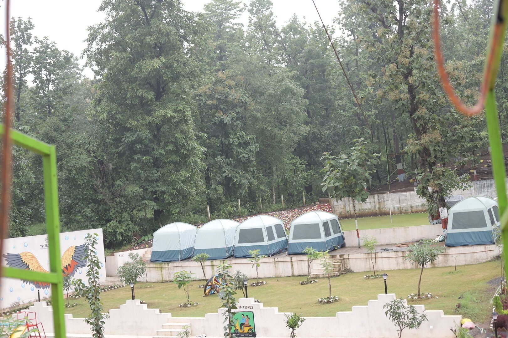 Premium bedding, down comforters, individually furnished, desk. Treebones resort and adventure park