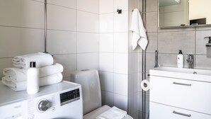 City Studio | Bathroom | Shower, hydromassage showerhead, hair dryer, towels - 10th floor studio with a great location (Tampere)