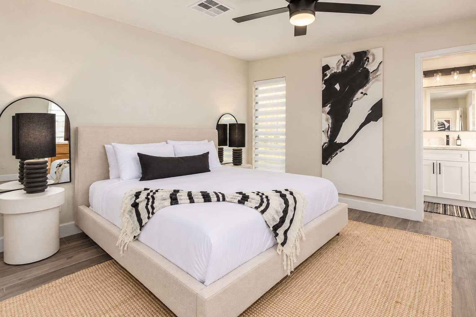 This bedroom has a big bed, soft white linens, and its own bathroom just off the room. Get ready in the morning without waiting your turn.