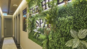 A reception area with a vertical garden and a sign that reads "THE HUBBI SPA". - The Hubi Hotel (Istanbul)