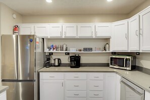 Coffee/tea maker, fridge, microwave, oven