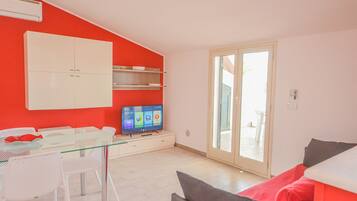 Suite Olimpo | Area soggiorno | TV, stampante
