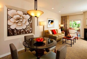 Relax in style with a comfortable sofa and dining area, perfect for casual meals or unwinding with a view.