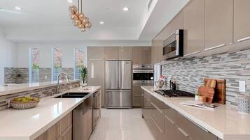 Villa | Private kitchen | Fridge, microwave, oven, stovetop