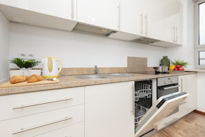 Apartment, 2 Bedrooms, 2 Bathrooms | Private kitchen | Dishwasher, cookware/dishes/utensils
