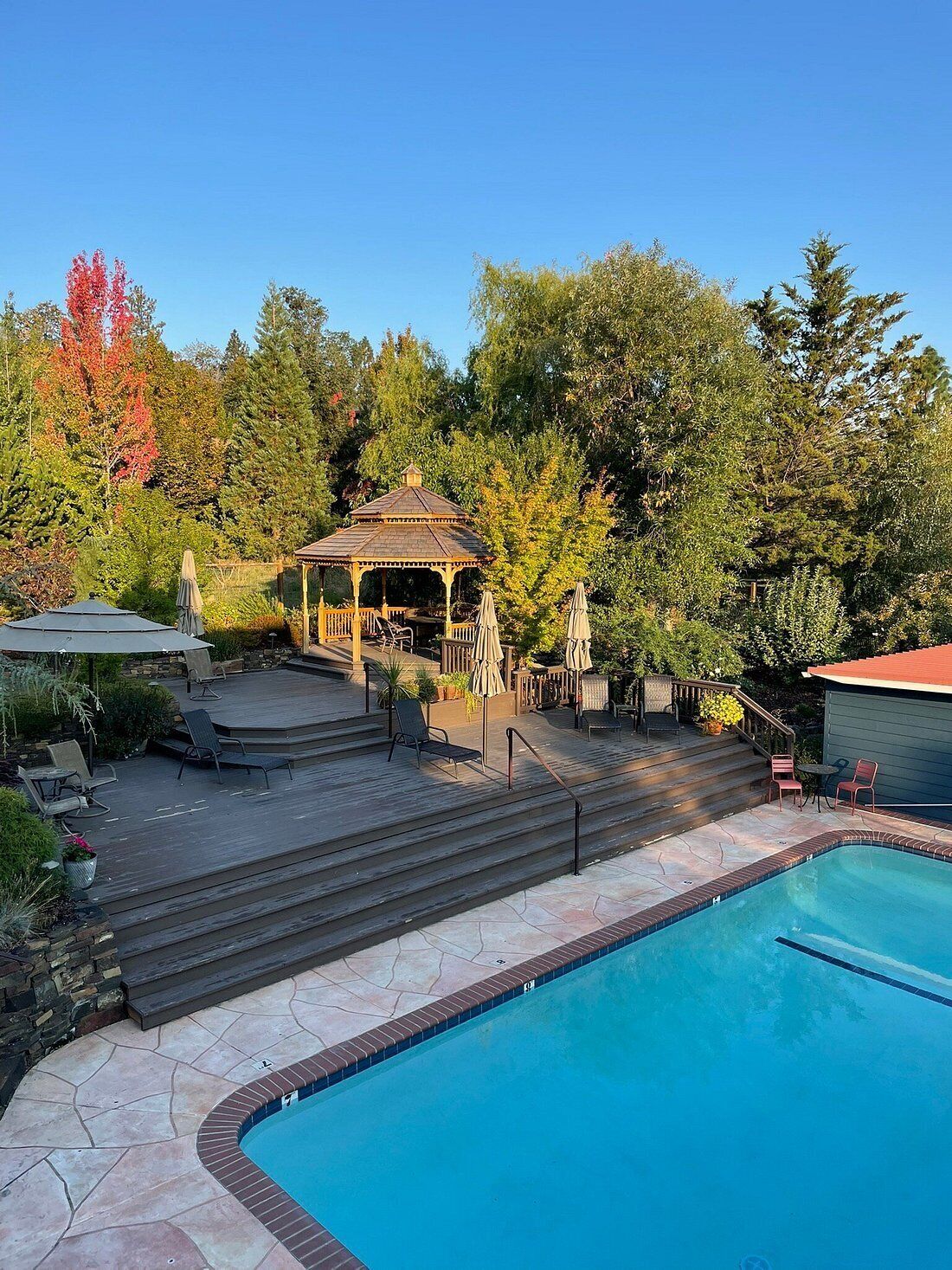 Seasonal outdoor pool, open 7:00 AM to 8:00 PM, pool umbrellas