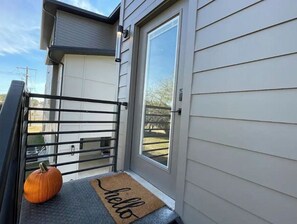 Welcome to a charming home with a driveway and inviting entrance.