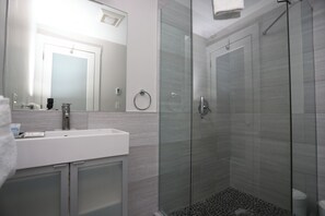 Economy Studio (Unit 2) | Bathroom | Shower, hair dryer, towels, soap - Maverick Suites at 40 Temple St (Boston)